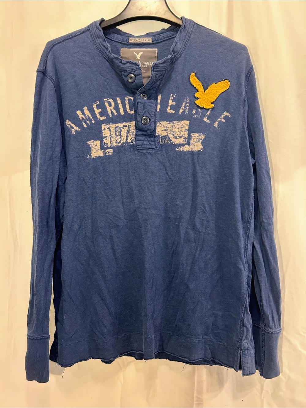 American Eagle Outfitters Men's Blue Long-Sleeve Henley with Yellow Eagle Patch